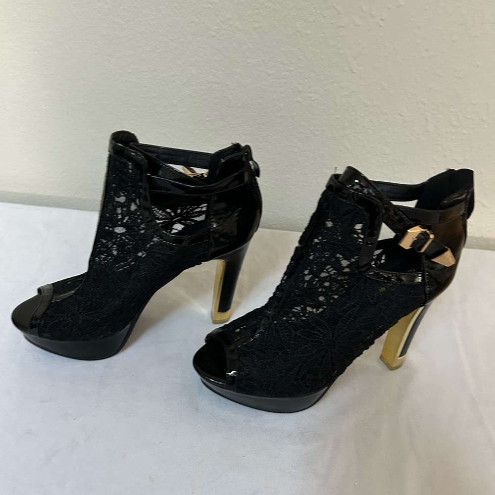 Chic Black Lace Heels with Gold Accents